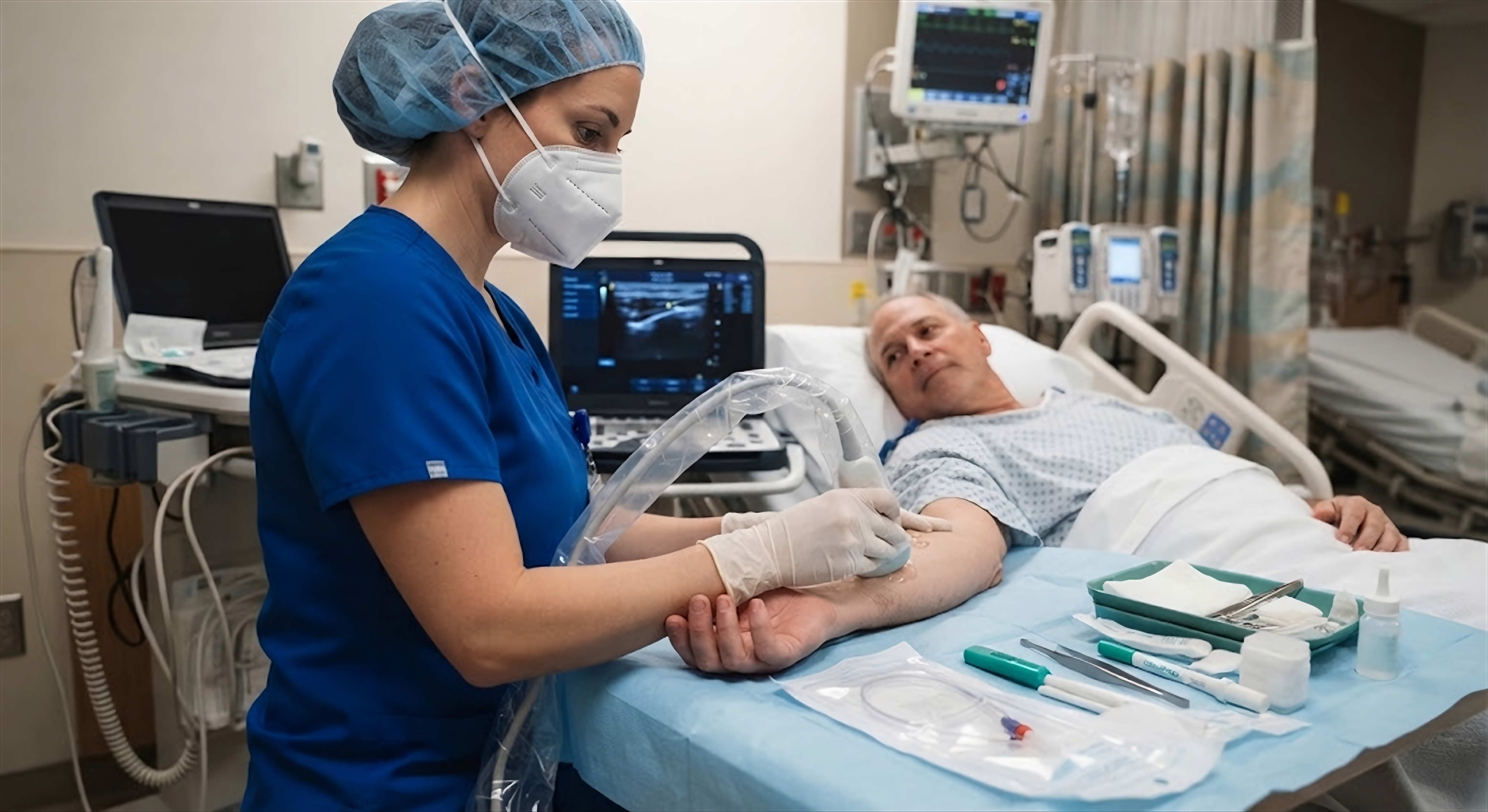 RN performing bedside ultrasound-guided PICC line placement